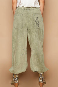 Floral embroidered pattern solid twill pants